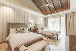 Ένα ή περισσότερα κρεβάτια σε δωμάτιο στο Modern villa with maid and pool in Casa de Campo +38 φωτογραφίες