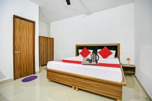 Postel nebo postele na pokoji v ubytování Hotel O Hc Punjab Inn + 19 fotografií