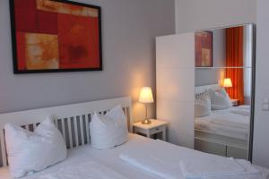 Ένα ή περισσότερα κρεβάτια σε δωμάτιο στο Residenz Unter den Linden 04 ruhig und zentral