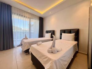 Ένα ή περισσότερα κρεβάτια σε δωμάτιο στο Salam Residence 2 - Woman Pool - Alanya Experience +155 φωτογραφίες