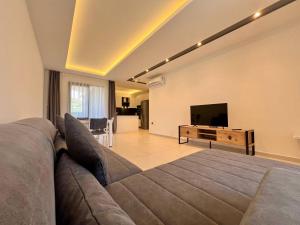 Μια τηλεόραση ή/και κέντρο ψυχαγωγίας στο Salam Residence 2 - Woman Pool - Alanya Experience