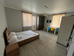 Postel nebo postele na pokoji v ubytování Уютный уголок + 5 fotografií