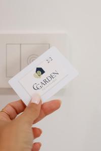 a person holding a card in front of a washing machine at CGarden in Reggio Calabria