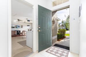 a door leading into a home with a kitchen at Villa Helena, Windsor Palms in Kissimmee
