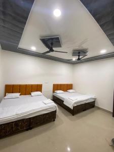 Ένα ή περισσότερα κρεβάτια σε δωμάτιο στο Avantika Home Stay