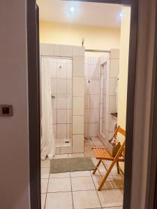 a bathroom with a walk in shower and a toilet at Apartman Vinkov's center in Jajce +21 photos