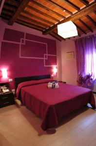 سرير أو أسرّة في غرفة في Bed & Breakfast Viziottavo