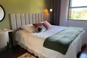 En eller flere senger på et rom på Casa na Serra Gaúcha com piscina