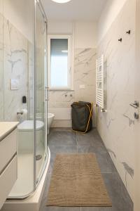 a bathroom with a glass shower and a sink at Mirti Suite Roma in Rome