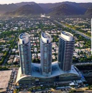 an aerial view of two tall buildings in a city at CENTAURUS ISB 2 BHK Plus Study in Islamabad