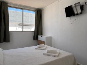 Postel nebo postele na pokoji v ubytování VMC Rooms