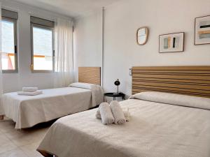 Postel nebo postele na pokoji v ubytování VMC Rooms