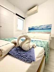Postel nebo postele na pokoji v ubytování Hostal RENCH