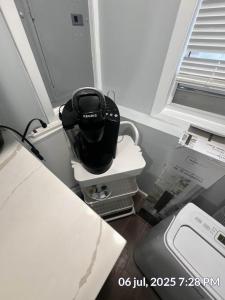 a hair dryer sitting on a counter next to a window at Studio Apt Lake Park Station Airport Hospital NJ NYC in Rahway +19 photos