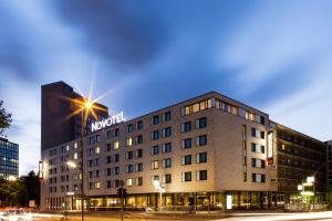 a hotel with a sign on the side of a building at Novotel Hamburg City Alster in Hamburg