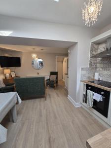 a living room with a couch and a fireplace at Galway City - 135 Bohermore in Galway