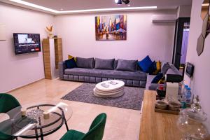 a living room with a couch and a table at R102-3-4 Amazing apartments in Belvedere with Breathtaking Ocean and Street Views in Casablanca