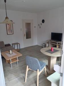 TV a/nebo společenská místnost v ubytování Lüttje Eiland