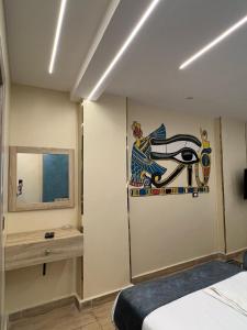 Postel nebo postele na pokoji v ubytování Red Pyramids Hotel