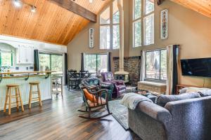a living room with couches and a bar in a house at Cabin Getaway Near Big Trees Park Game Room, Deck in Camp Connell