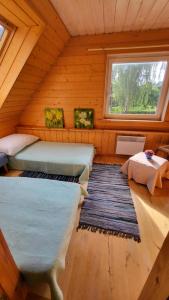Ένα ή περισσότερα κρεβάτια σε δωμάτιο στο House with sauna near of lake Viljandi