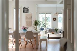 a kitchen and living room with a table and chairs at Come in! "Pirkkala" Spacious city Family Villa near Lake & Airport in Pirkkala