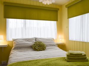 Postel nebo postele na pokoji v ubytování Lenas Lodge + 4 fotografie