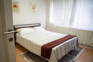 Ένα ή περισσότερα κρεβάτια σε δωμάτιο στο Apartman CornerOne