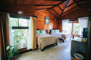 En eller flere senge i et værelse på Montaña de fuego Mountain Resort & Spa + 109 billeder