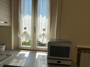 A television and/or entertainment centre at Casa vacanze l’orchidea