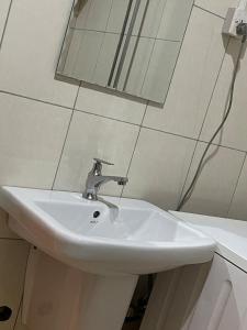 Koupelna v ubytování Wakanda Homes + 27 fotografií