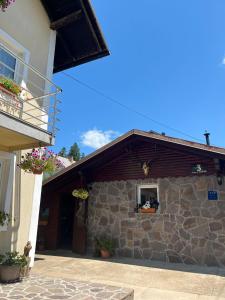 a building with a window and a stone wall at Drago Kremenjaš in Delnice