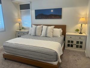 a bedroom with a large bed with two night stands at New Resort Condo Near Zion Great for Families Pools Water Slide in Hurricane +31 photos