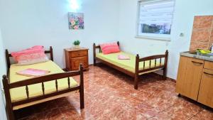 Ein Bett oder Betten in einem Zimmer der Unterkunft Villa Dusper