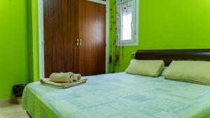 Ένα ή περισσότερα κρεβάτια σε δωμάτιο στο Apartamento Gerard +35 φωτογραφίες