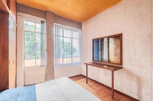 Postel nebo postele na pokoji v ubytování casa de los espejos Av Cuauhtémoc