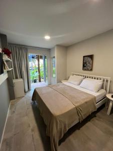 En eller flere senge i et værelse på Pousada Divino Milagre