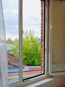 a window with a view of a street at Modern apartment! in Hazebrouck