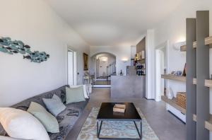 a living room with a couch and a table at Portofino Riviera Luxury Villa-Pool,Garden,Parking in Zoagli