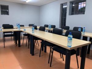 a row of tables with bottles of water on them at GMC-facilities in Centurion +6 photos