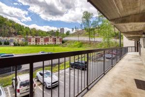 a balcony with cars parked in a parking lot at Modern Condo, W Fireplace & Pool In Gatlinburg! in Gatlinburg