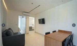 TV a/nebo společenská místnost v ubytování Porto Alto Resort Muro Alto Porto de Galinhas