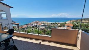 a balcony with a view of the ocean at Alexandras Villa in Skala Marion