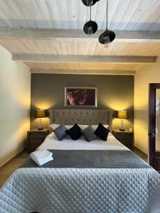 เตียงในห้องที่ Hotel Boutique Rancho San Jorge