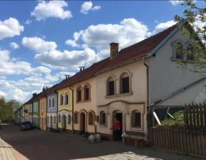 a man standing in front of a building at Nechory,sklep u Klárky in Prušánky