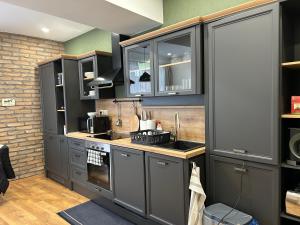 A kitchen or kitchenette at Péterfia Boutique Apartments