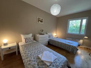 Ένα ή περισσότερα κρεβάτια σε δωμάτιο στο R-Joki Apartments