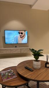 TV a/nebo společenská místnost v ubytování الاطلاله البانورامية