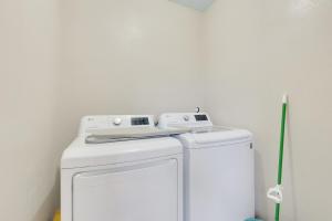 a white washer and dryer in a room at Walkable Private Guest House Studio with Pickleball Court in Austin +22 photos