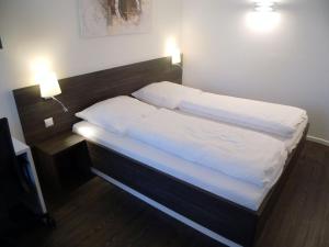 Ένα ή περισσότερα κρεβάτια σε δωμάτιο στο Boardinghaus Weinberg Campus